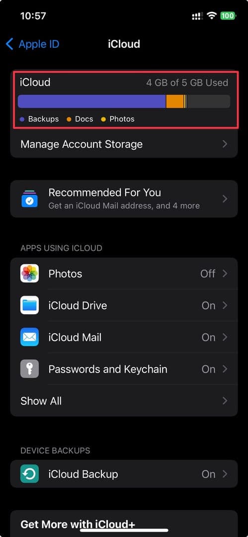 The image showcases the iCloud settings on an iPhone, displaying the storage usage. It indicates that 4 GB of 5 GB is used, with the storage breakdown for backups, documents, and photos. The interface is clean and modern, with a dark theme, and the user can manage account storage and other iCloud features.